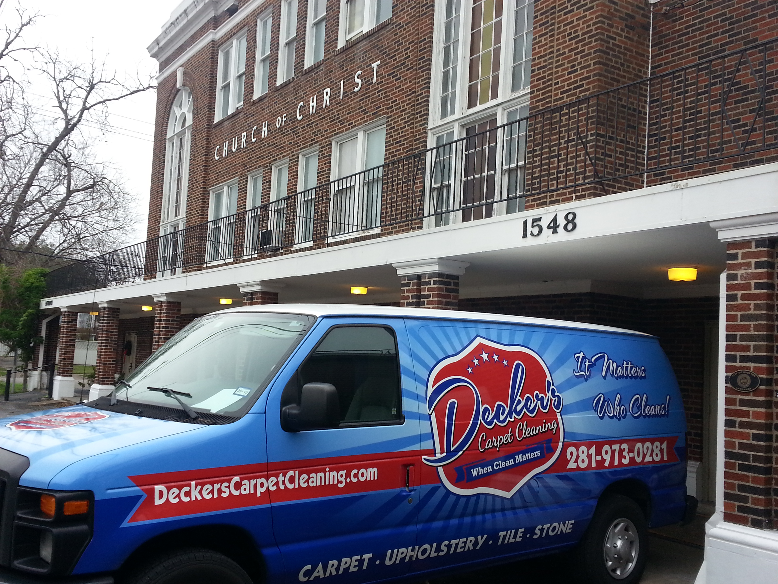 Decker's Carpet Cleaning Van Parked outside of church building